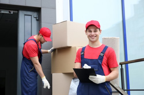 Removal team handling furniture during a Clerkenwell home move